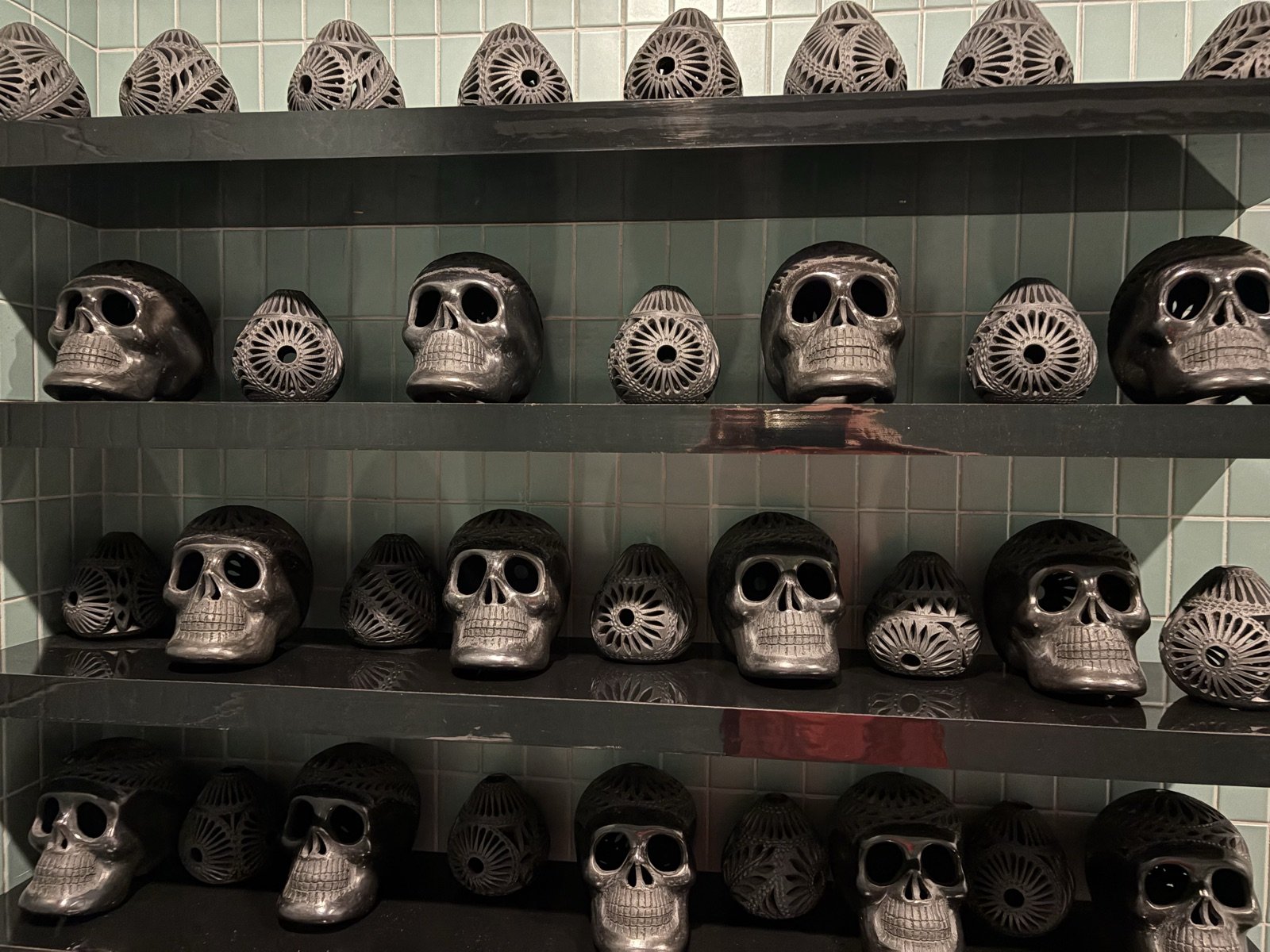 The regulars - a shelf of Mexican skulls setting the mood
