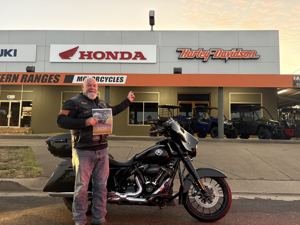 Western Ranges Motorcycles, Tamworth - rider with ABC calendar in the sunrise light