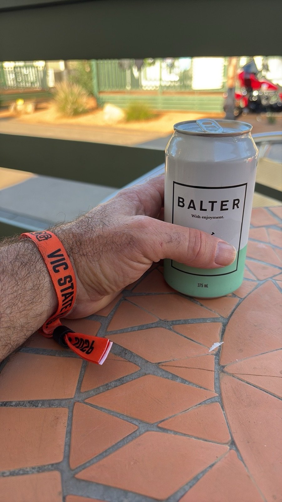 Hard earned - rally wristband on, cold one in hand, Shepparton